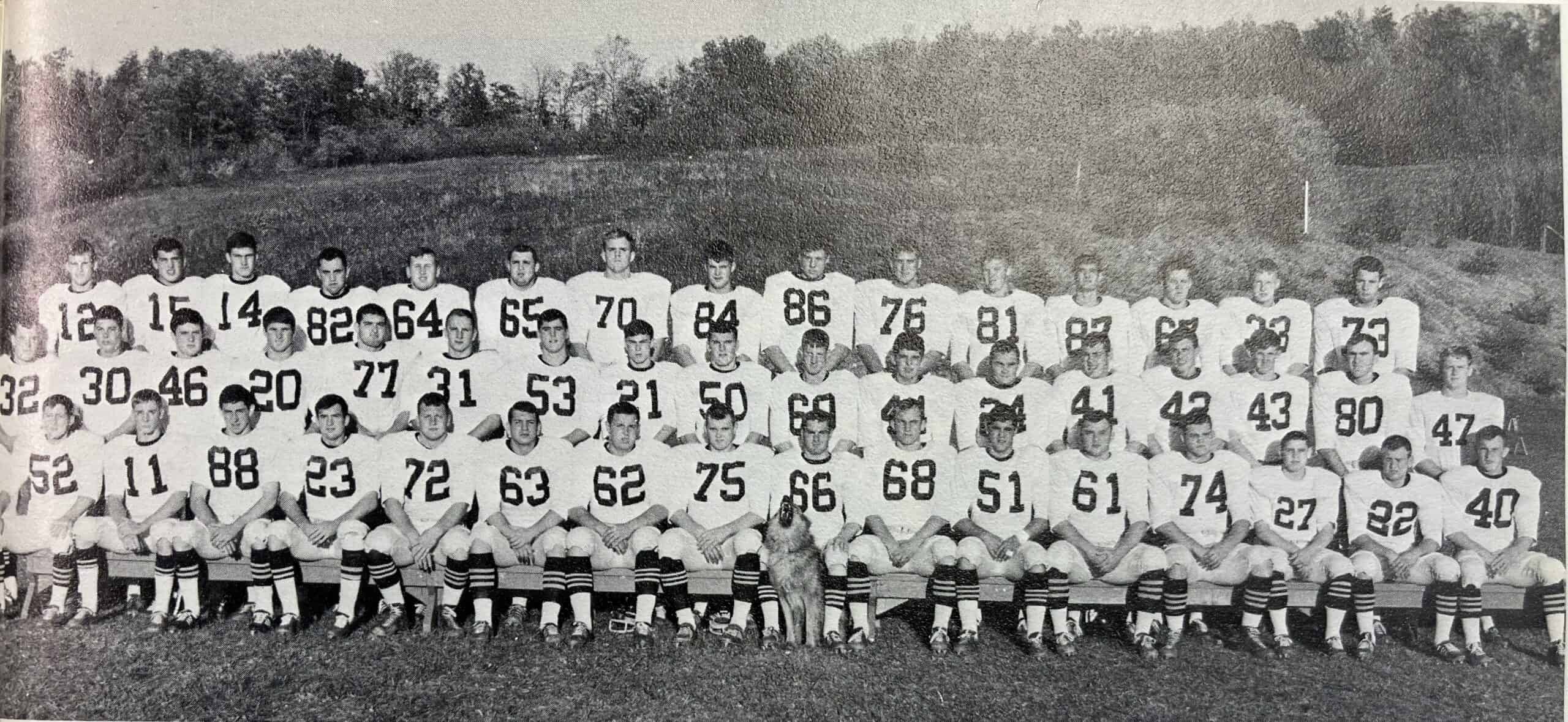 4 rows of seated football players in 1966 in black and white
