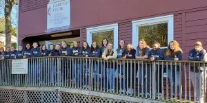 Softball Players Collect Over 3,500 Canned Food Items for St. James Center