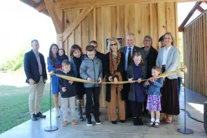 Members of the Scott family cut the ribbon commemorating the Leo H. Scott Educational Pavilion.
