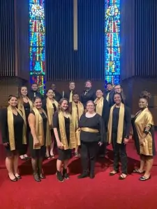 Members of the Ferrum College Chorale pose for a photo in Vaughn Chapel on campus.