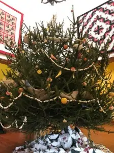 A beautifully decorated live Christmas tree is only display during the Blue Ridge Institute and Museum's December 12 Open House.