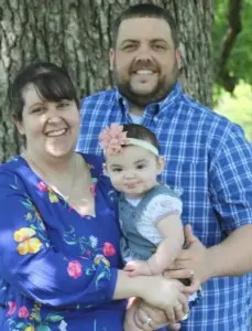 Caitlin Menefee with husband Earl and daughter Ella.