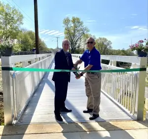David Johns and Tim Tatum cut the ribbon dedicating the new Ferrum Pedestrian Bridge.