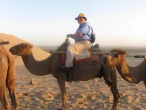 Richard Smith atop a camel.