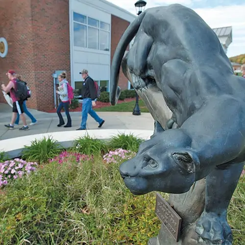 Ferrum College panther statue at Franklin Hall with students