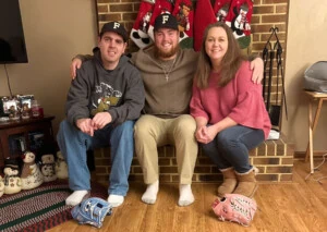Ferrum College student-athlete Steven Ritchie with his mother and brother