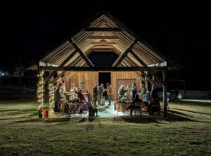 Farm museum pavilion at night light up with Christmas vendors inside