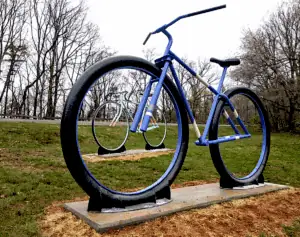 Big Old Bikes sculpture by Jake Smith, 2 giant bikes in park setting