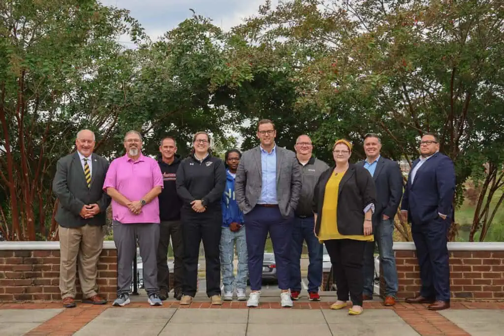 Members of the 2025 Ferrum ABOD pose outside beneath trees on campus.