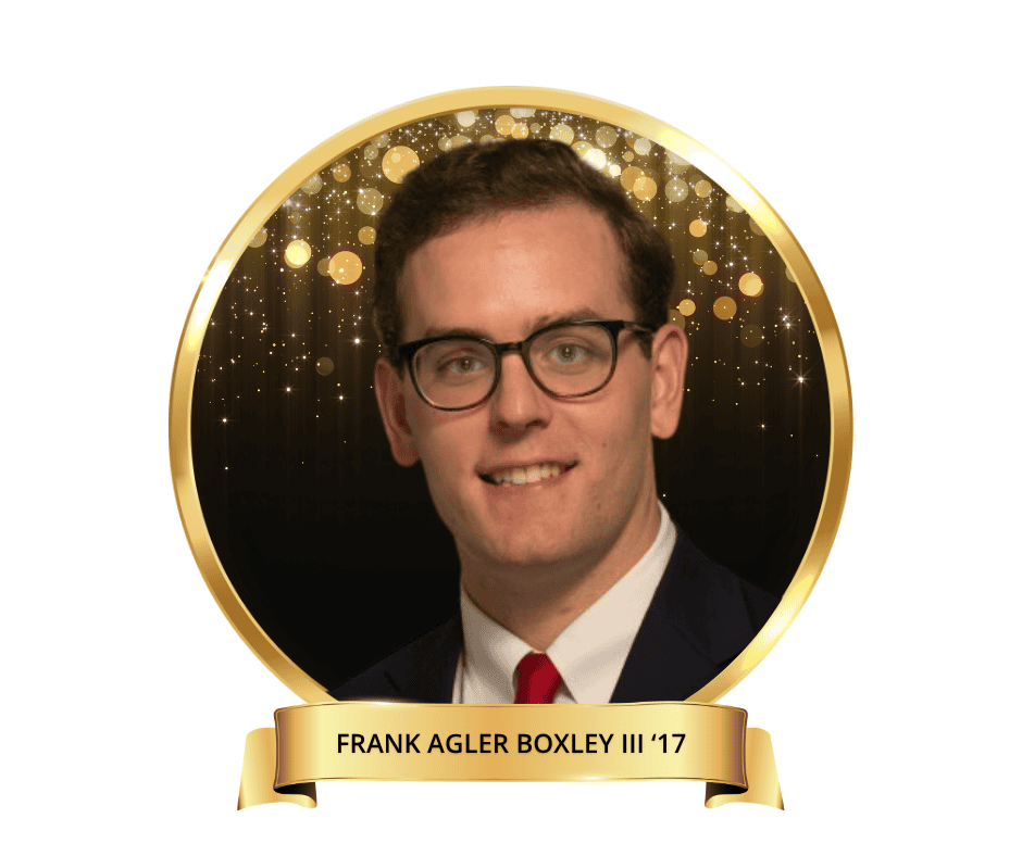 A headshot photo of Frank Agler Boxley. He's wearing glasses, a black suit, a white undershirt, and a red tie.