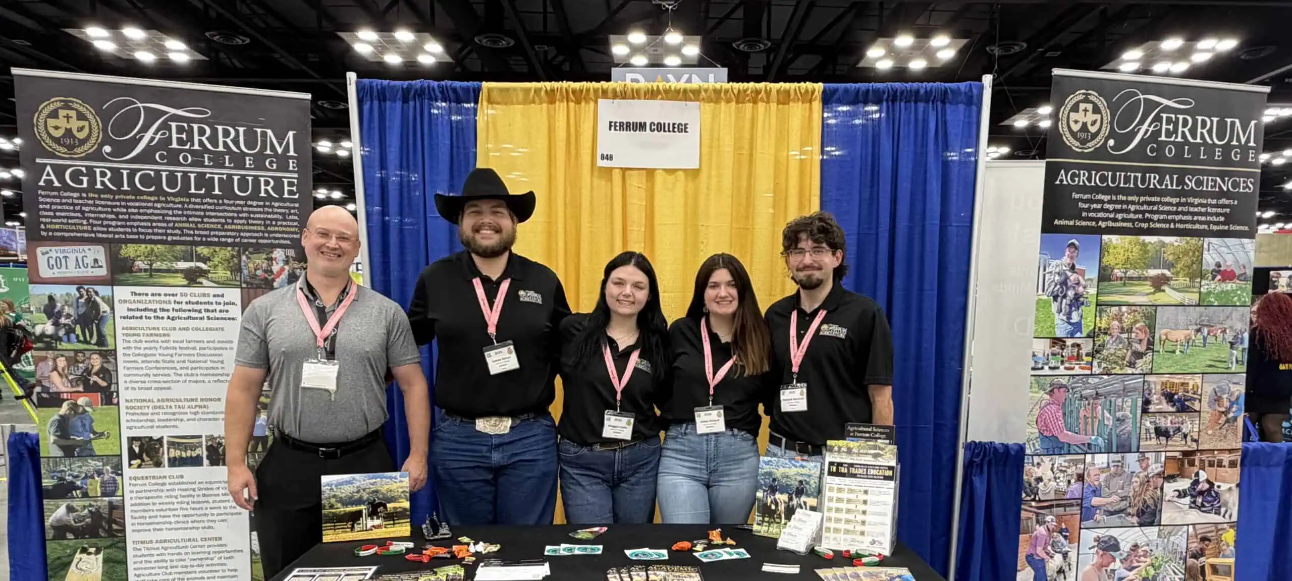 One agriculture professor and 4 students with FFA convention display representing agricultural sciences at Ferrum College