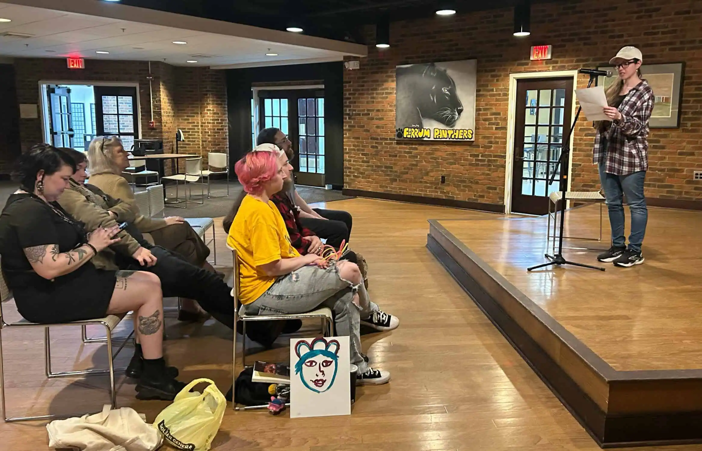 Students and staff watching a performance during Coffee House