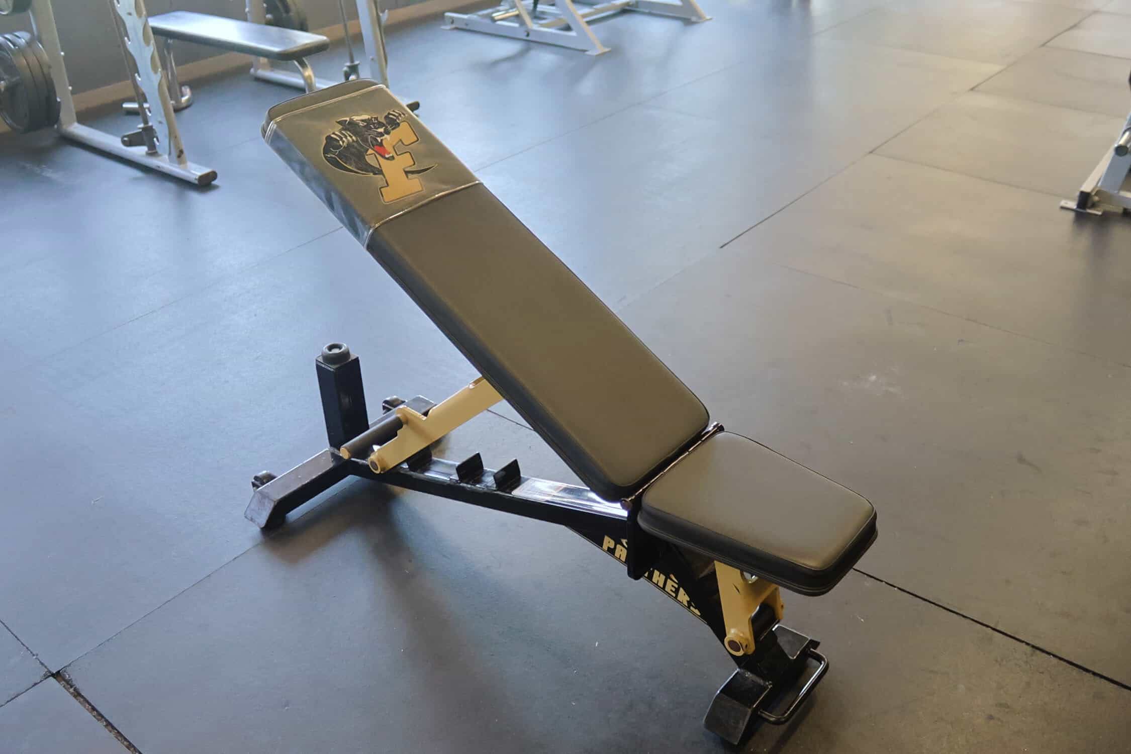 A free weight bench that is inclined. The bench has four levels to raise it's incline.