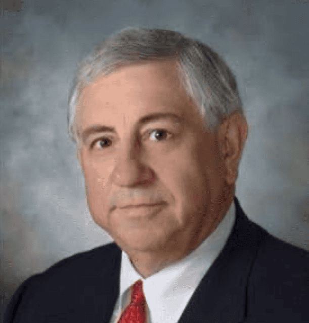 Headshot of George Yancy in dark suit and red tie
