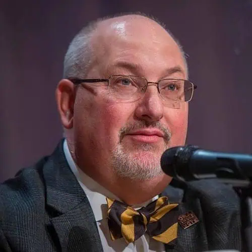 Photo of Glynn Loope with microphone