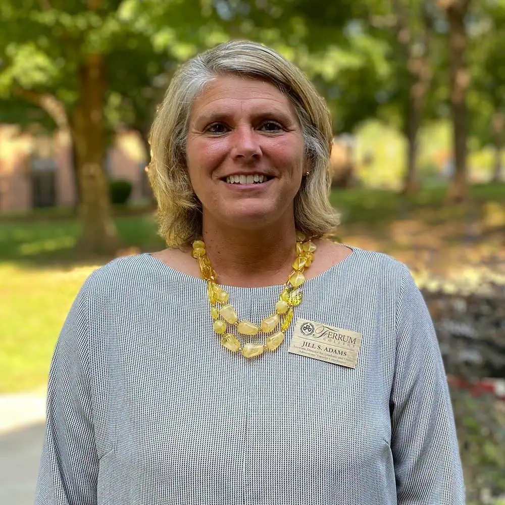 Headshot of Ferrum College staff Jill Adams standing outside on campus.