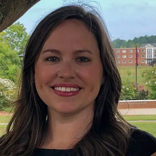 Headshot of Ferrum College staff Vanessa Stone standing outside near a tree.