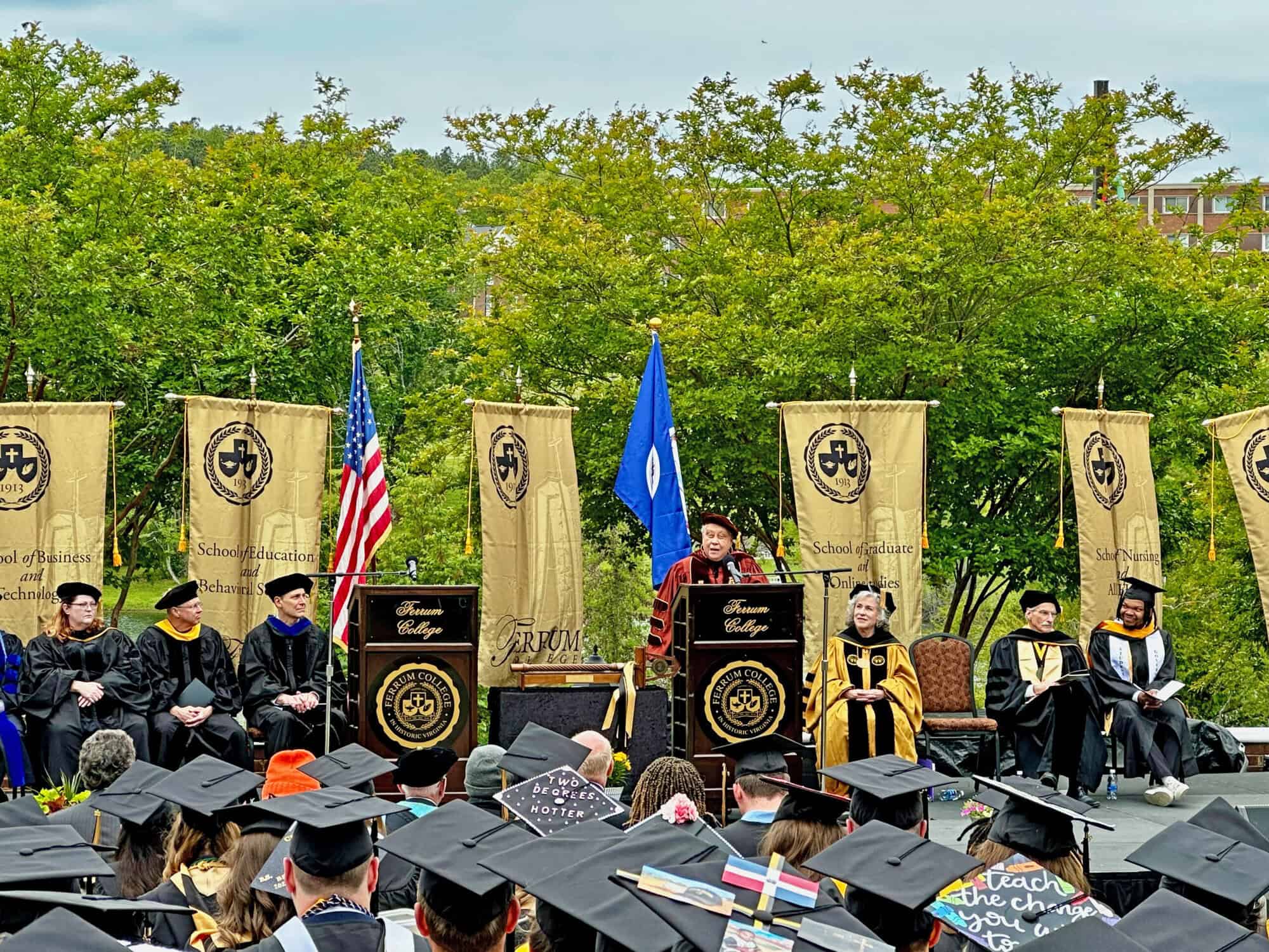 Ferrum College graduation ceremony with faculty, graduates, and speakers. Students in caps and gowns celebrate academic achievement and future success.