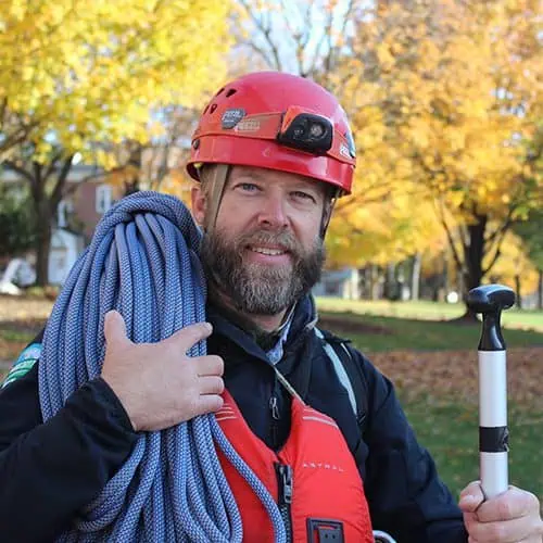 Headshot of Ferrum College staff Aaron Conover wearing hiking gear.