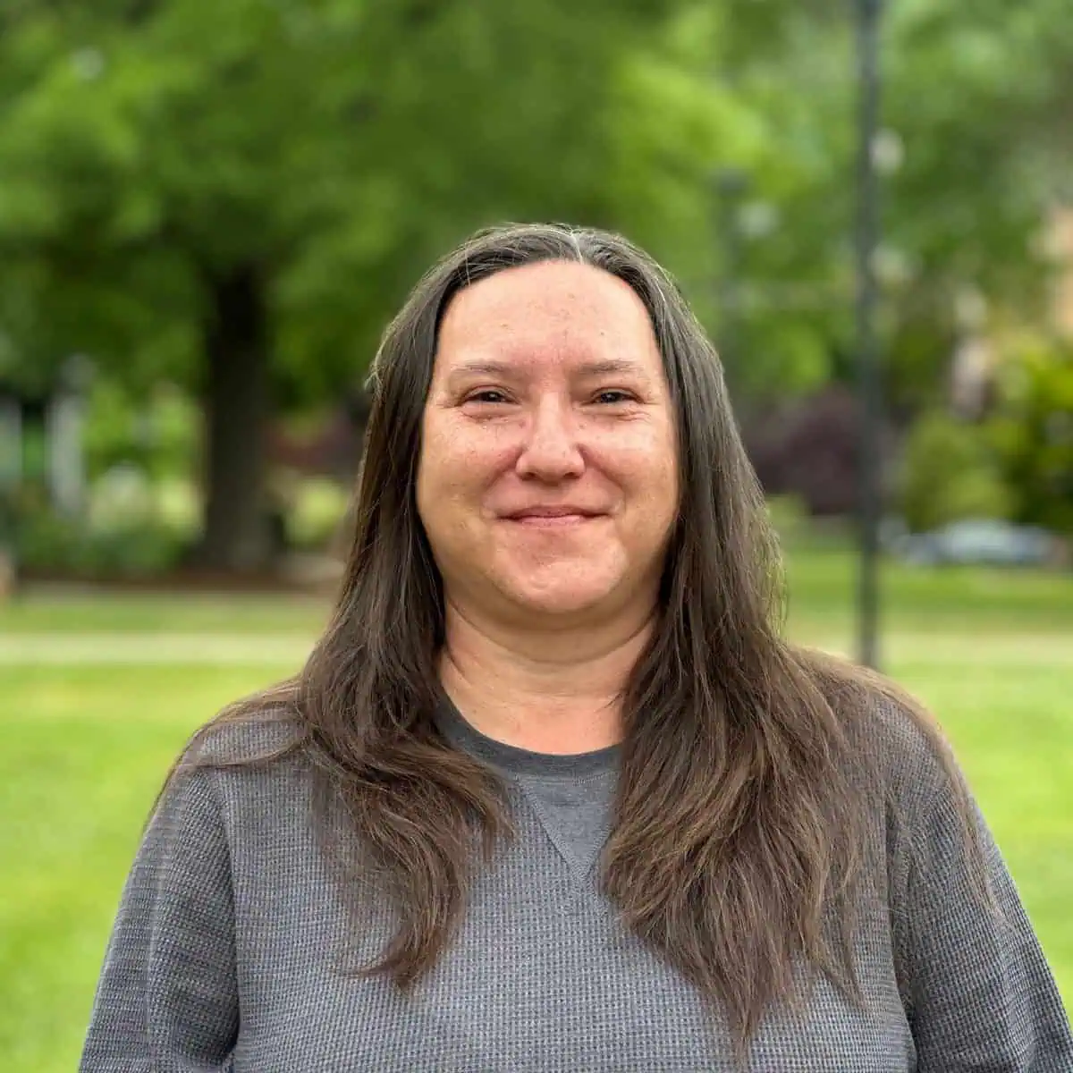 Photo of Ferrum College Building Attendant Etta Bradley taken on campus with green grass in the background