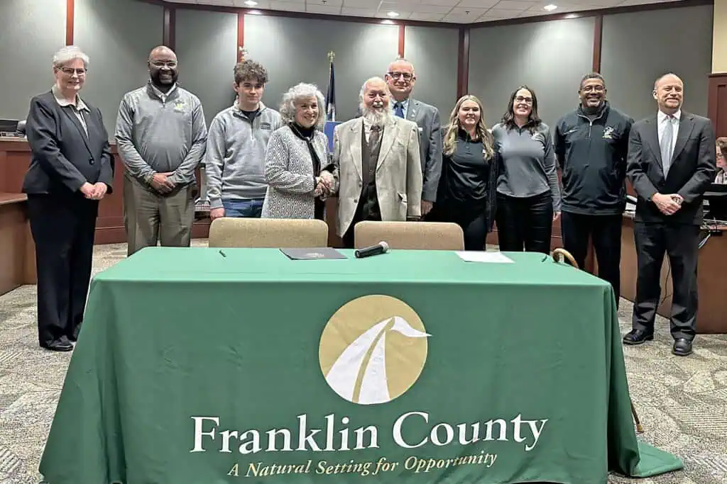 In the photograph (L to R): Ferrum College Vice President of Institutional Advancement Chris Watters, Ferrum College Head Football Coach Kevin Sherman, Franklin County resident and Ferrum College senior William Hodges, Ferrum College President Mirta Martin, Franklin County Board of Supervisors Chairman Ronnie Thompson, Blue Ridge District Supervisor Tim Tatum, Ferrum College Head Women's Lacrosse Coach Carly Coyle, Ferrum College Head Women's Soccer Coach Erin Saleeby, Ferrum College Athletics Director Cleive Adams, and Franklin County Administrator Christopher Whitlow.