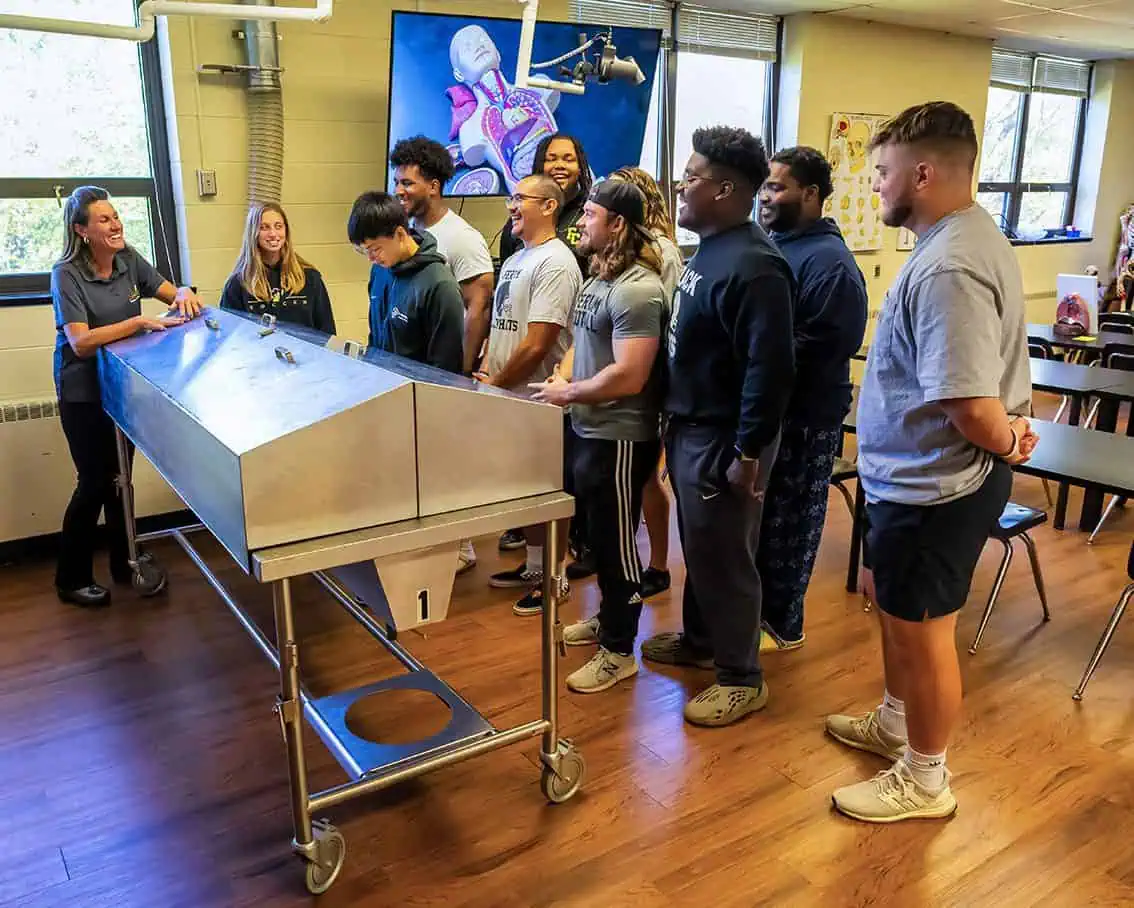 Health Science class watching a demonstration by professor