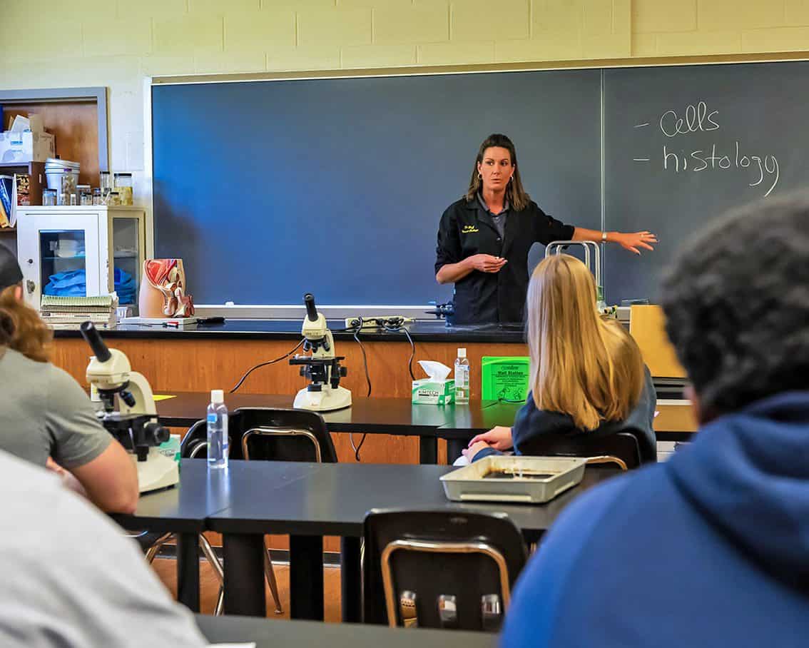 Ferrum College's Dr. Katie Goff teaching a group of students in the anatomy lab