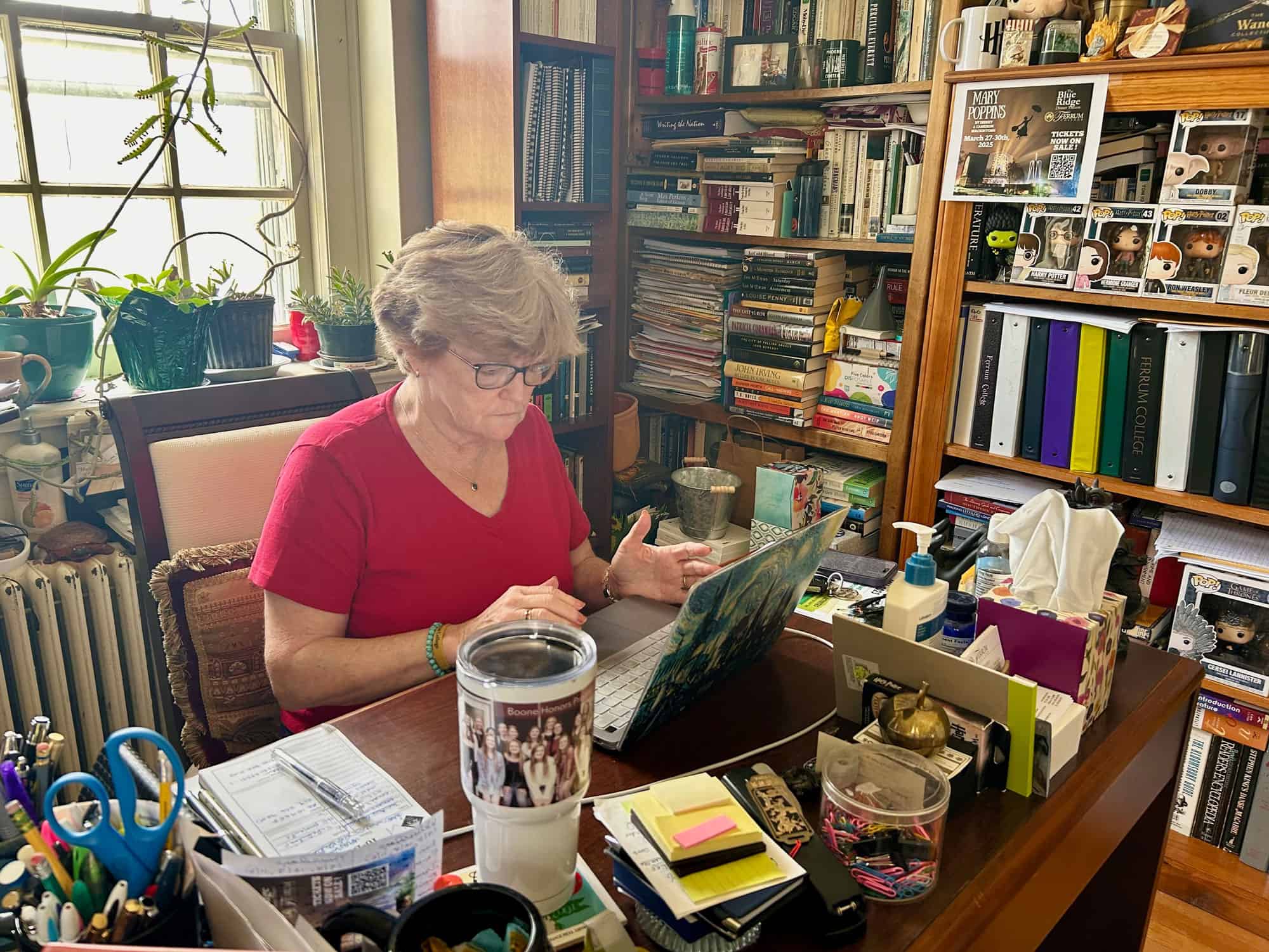 Dr. Lana Whited writes at her desk in Britt Hall at Ferrum College