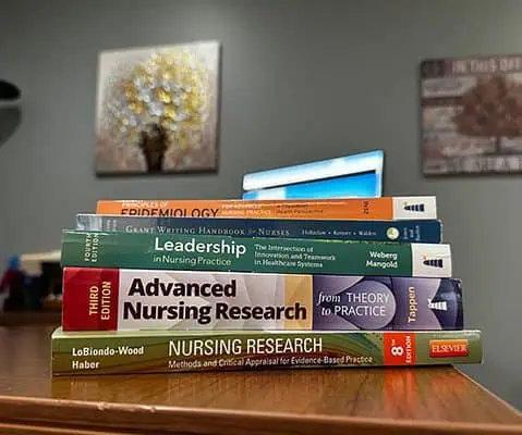 A stack of text books used in the MSN program at Ferrum College