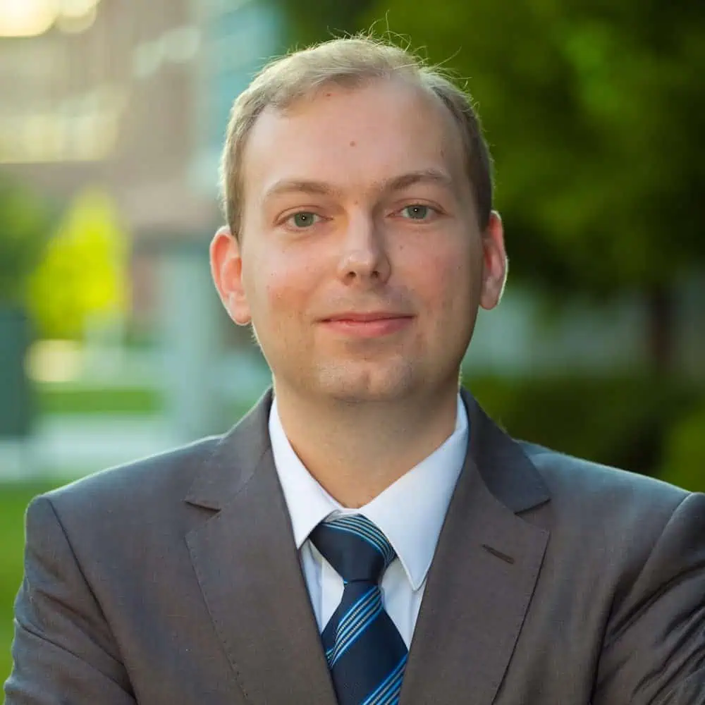 Ferrum College Assistant Professor of Business Roman Bohdan wearing a suit and tie.